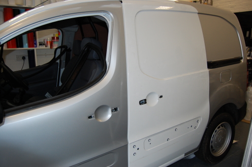 white van wrapped in metallic silver