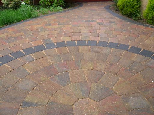 Circle laid in autumn gold alpha setts with charcaol ring