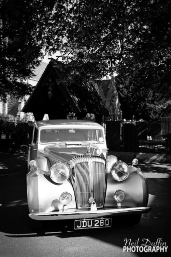 Classic wedding car waiting for the happy couple