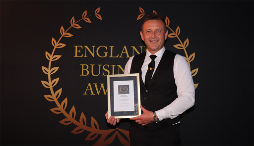 James Pittam collecting award best small business