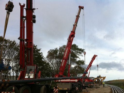 Various Cranes Lifting Electrical Pipe