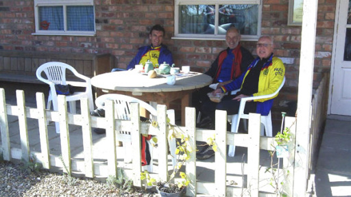 a group of cyclists enjoying a cuppa.