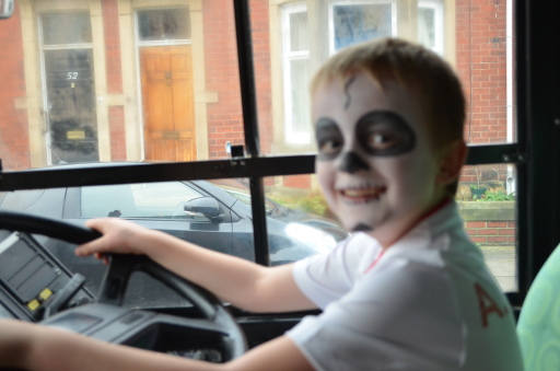 Charlie having his photo taken in the drivers seat