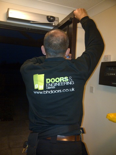 door engineer servicing automatic door
