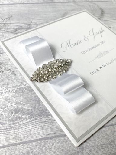 Luxury wedding invitation with diamante brooch
