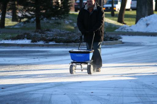 Rock salt spreader in use