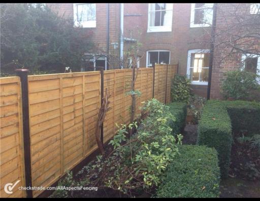Larch lap panels on timber posts with timber gravel boards