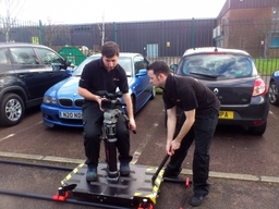 Crew operating a dolly