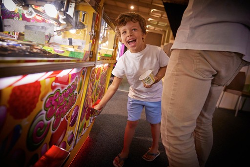 Family playing in the arcade at Hunters Quay Holiday Village