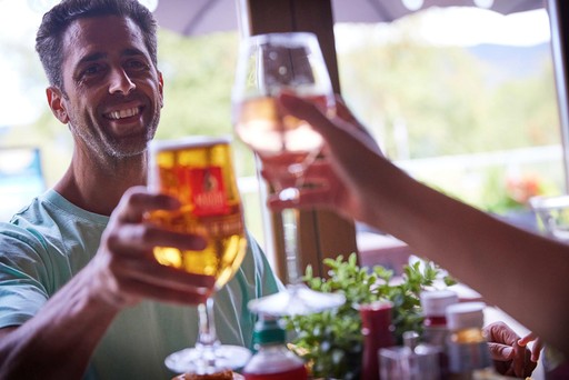 Family enjoy a meal in Hunters Bar and Grill at Hunters Quay Holiday Village