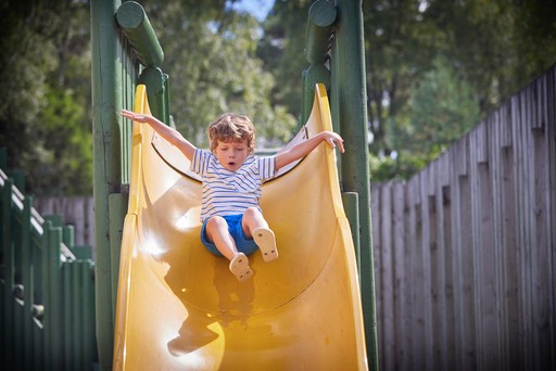 Child having fun at the outdoor play area at Hunters Quay Holiday Village
