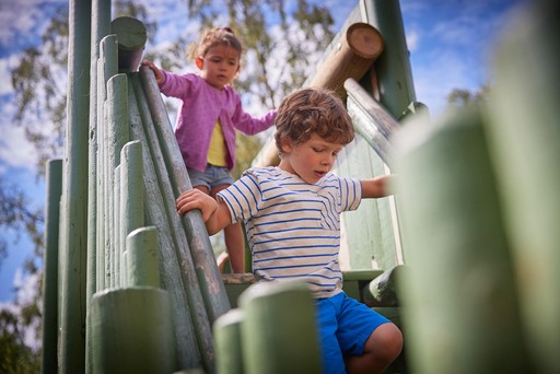 Children playing at the outdoor play area at Hunters Quay Holiday Village