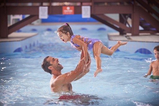 Family have fun playing in the swimming pool at Hunters Quay Holiday Village