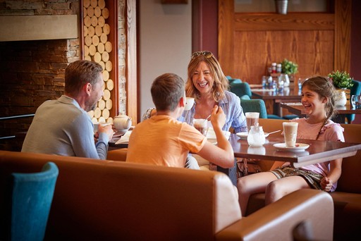 Family enjoy Costa drinks in Hunters Bar and Grill at Hunters Quay Holiday Village