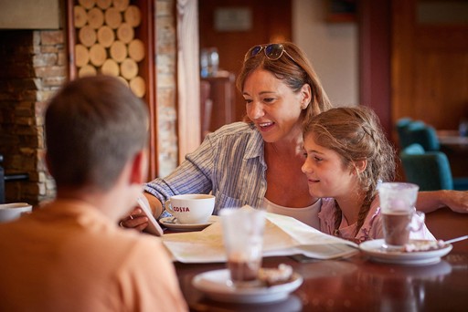 Family enjoy Costa drinks in Hunters Bar and Grill at Hunters Quay Holiday Village