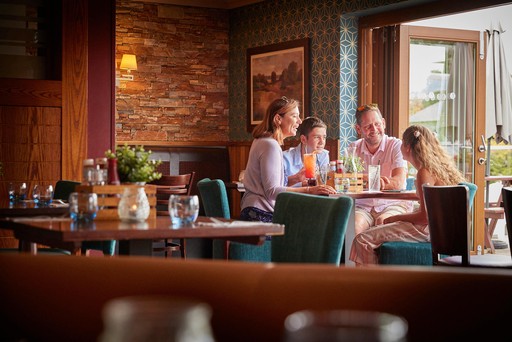 Family enjoy drinks in Hunters Bar and Grill at Hunters Quay Holiday Village
