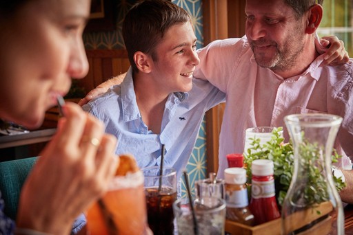 Family enjoy drinks in Hunters Bar and Grill at Hunters Quay Holiday Village
