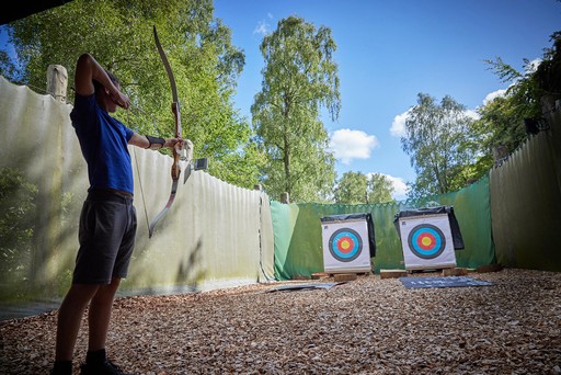 Taking part in the Archery activity at Hunters Quay Holiday Village