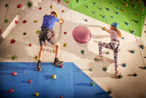 Kids taking part in the Climbing Wall activity at Hunters Quay Holiday Village