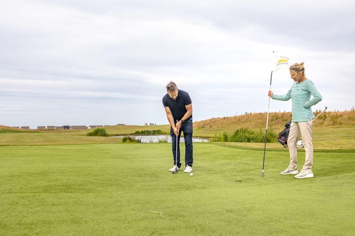 Couple play a round of Golf on our Famous 9 course at Gwel an Mor