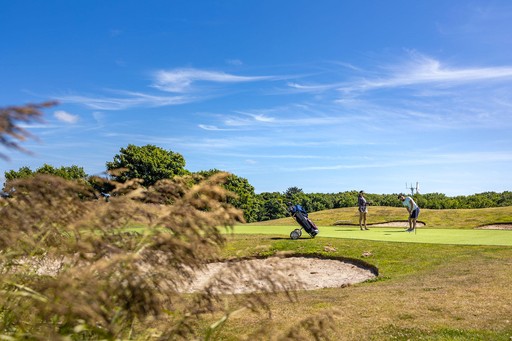 Couple play a round of Golf on our Famous 9 course at Gwel an Mor