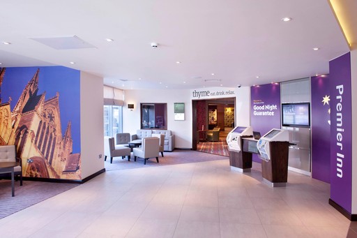 Premier Inn reception with check in desk and kiosks
