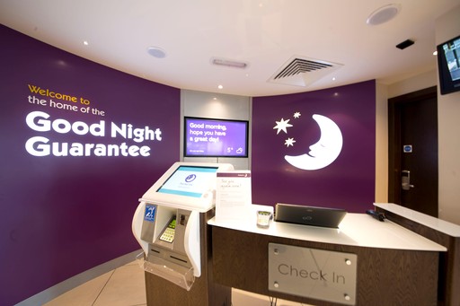 Premier Inn reception desk with kiosks