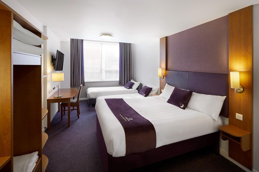 Premier Inn family room with double bed, two single beds and a flat screen TV