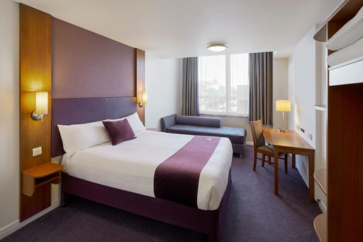 Premier Inn bedroom with double bed and sofa