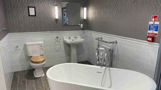 Nabis Traditional sanitaryware with free standing bath and chrome accents.