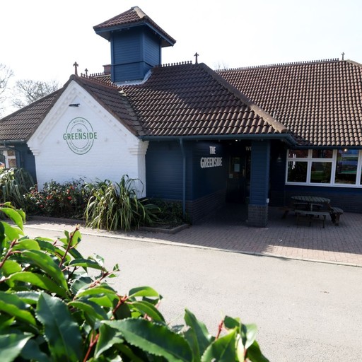 Exterior view of The Greenside with clear signage and welcoming entrance, set within a relaxed suburban setting.