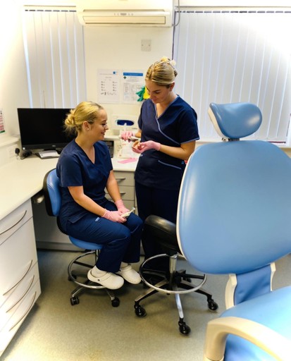 Georgia (lead nurse) and Mia (apprentice nurse) engaging in some in-house training