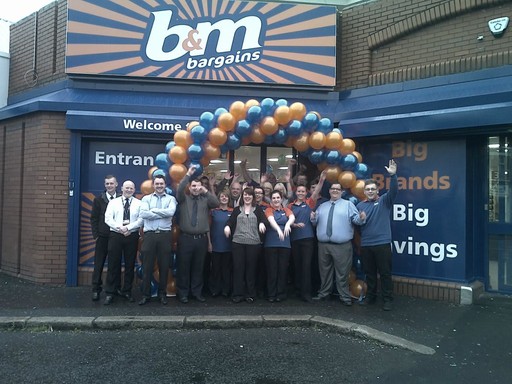 Staff outside the new B&M Bargains on Cregagh Road, Belfast celebrate its opening on Friday