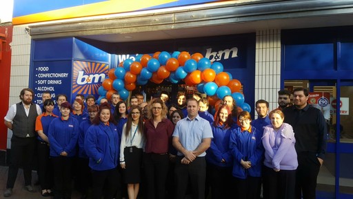 B&M Ashford's store team pose proudly outside their brand new Bargains store on High Street.