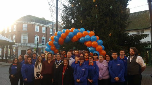 B&M Ashford's store team pose adjacent to their new store on High Street.