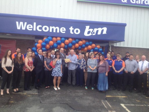 Liz, a representative of Pennar Community Hall, B&M's Local Hero for the day, gratefully receiving £250 worth of B&M vouchers.