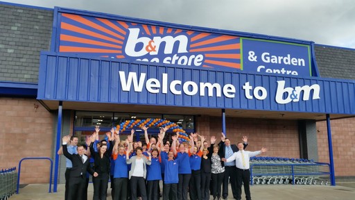 Staff pose outside the new B&M Inverness Home Store & Garden Centre, Telford Retail Park