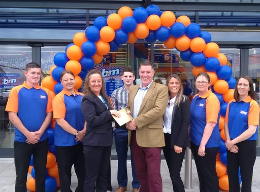 Local charity Simon on the Street gratefully receiving £250 worth of B&M vouchers as a thank you for helping to open the new B&M Armley.