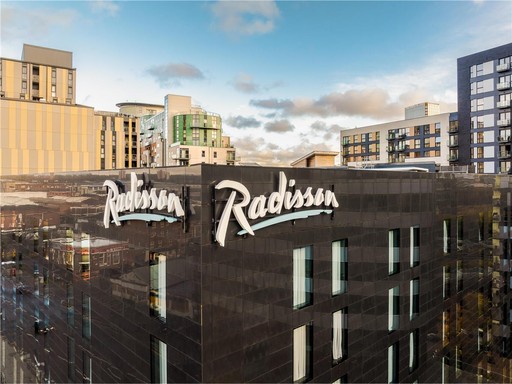 Radisson Machester City Centre exterior day drone