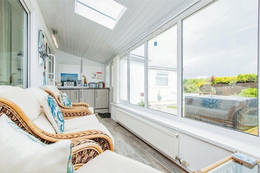 Conservatory to relax in with a glass of wine.