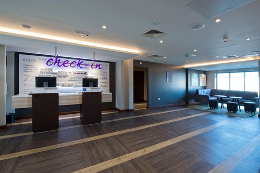 Premier Inn reception with check in desk and kiosks