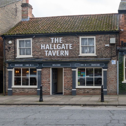 Exterior view of The Hallgate Tavern with clear signage and welcoming entrance.