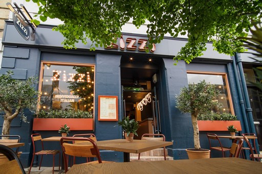 Exterior view of Zizzi St Andrews entrance and outside dining area.