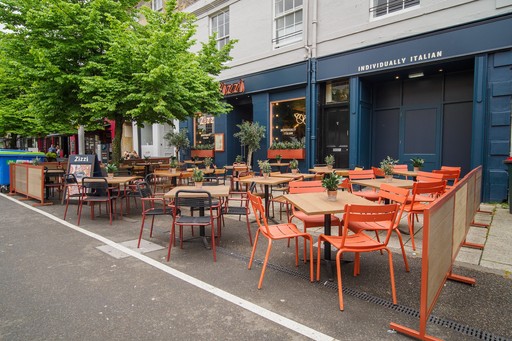 Exterior view of Zizzi St Andrews entrance and outside dining area.