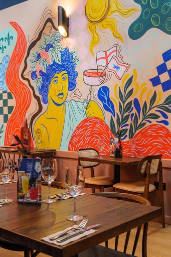 Warm Zizzi Winchester interior with vibrant décor and art murals.