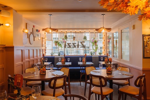 Warm Zizzi Winchester interior with cosy booths and view outside.