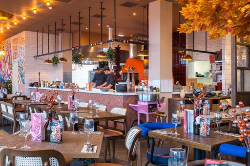 Zizzi Inverness, open kitchen with large mural by artist.