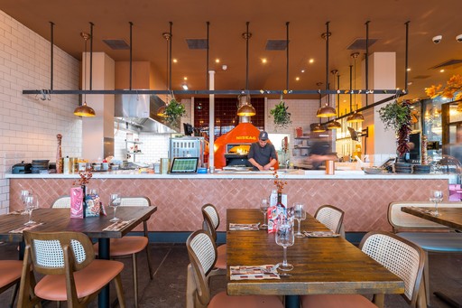 Zizzi Inverness, open kitchen with large mural by artist.