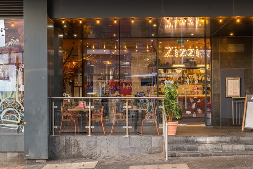 Zizzi Inverness, open-plan dining with full-height windows overlooking the River Ness.