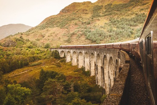 The Royal Scotsman, A Belmond Train, on bridge in the Scottish Highlands